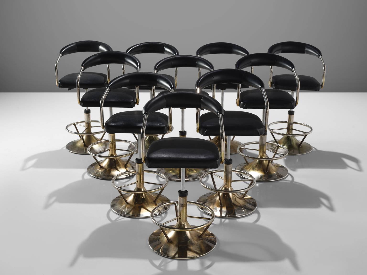 Set of ten barstools, in brass colored metal and black leatherette, Europe, 1970s.

Highly comfortable high barstools with backrest in black faux leather upholstery. Due to the soft seat and back, these chairs provide a high sitting comfort. The