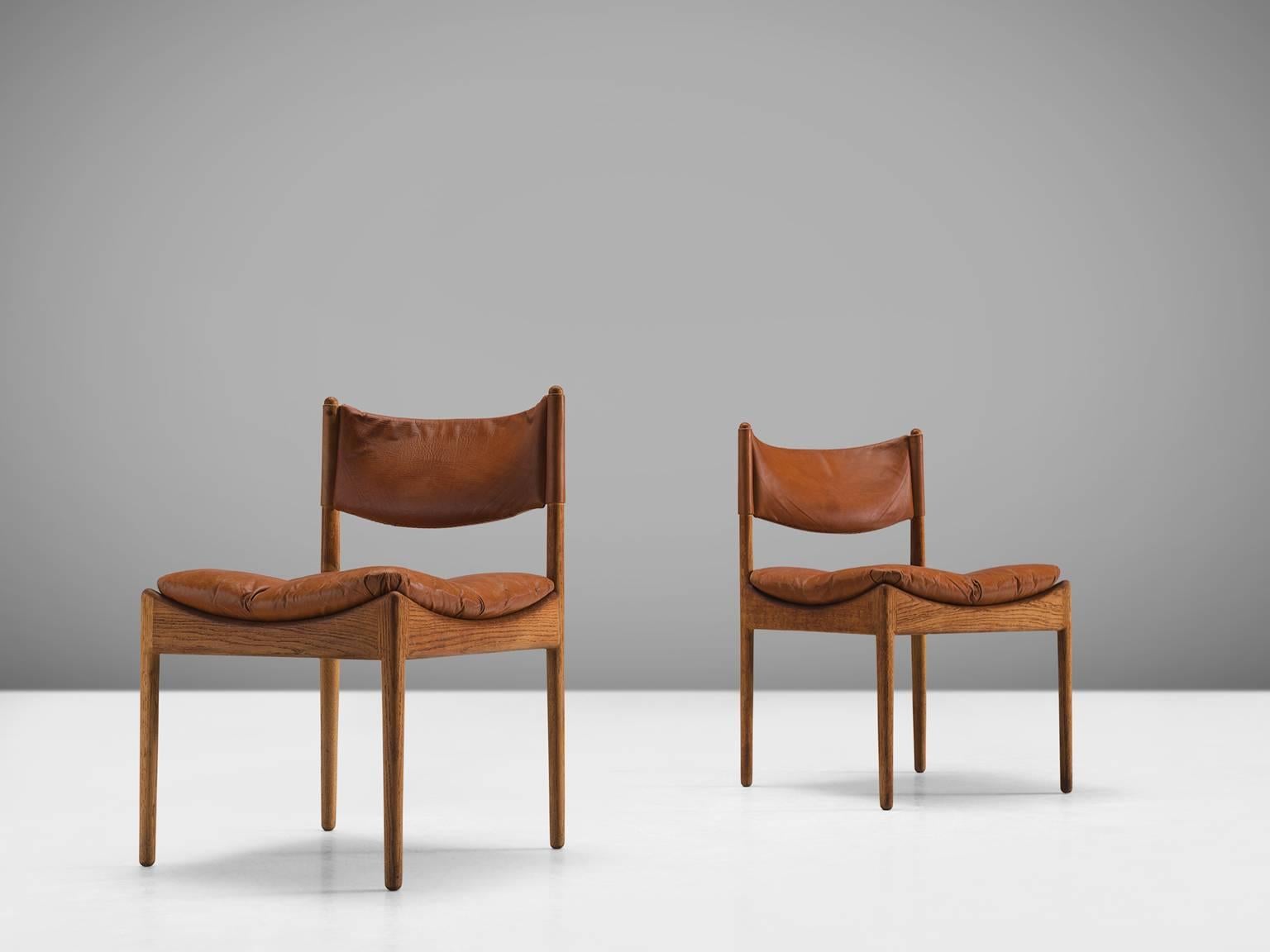 Kristian Solmer Vedel for Søren Willadsen, side chairs 'Modus', in oak and cognac leather, Denmark, 1963.

This set of two side chairs is one of Vedel's most popular designs. The chairs feature a soft, loose cushion of leather. The backs and arms