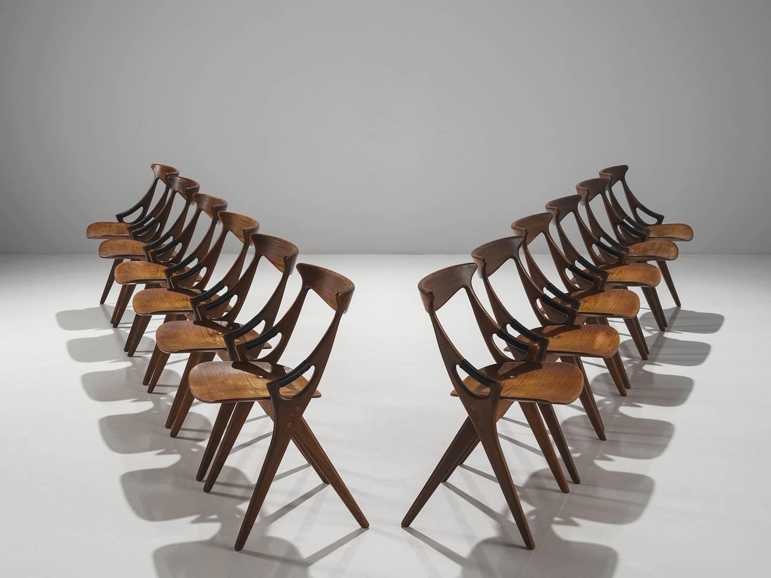 Arne Hovmand-Olsen for Mogens Kold Møbelfabrik, set of 12 dining chairs model 71, teak, Denmark, 1959.

This sculptural set of eight dining chairs is designed by the Dane Arne Hovmand-Olsen for Mogens Kold Møbelfabrik are quintessentially Danish.