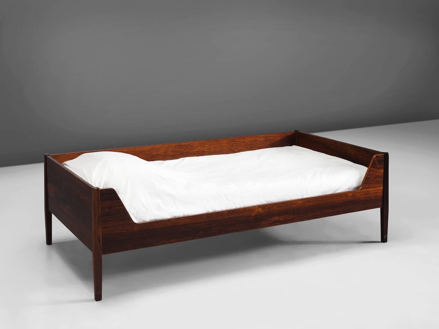 Kaj Winding for Poul Hundevad, bed model PH 22 BJ, rosewood, Denmark, 1960s 

This elegant bed is executed in rosewood and the color and grain is deep and warm. It is the color and richness of the wood that defines this slim and elegant frame. The