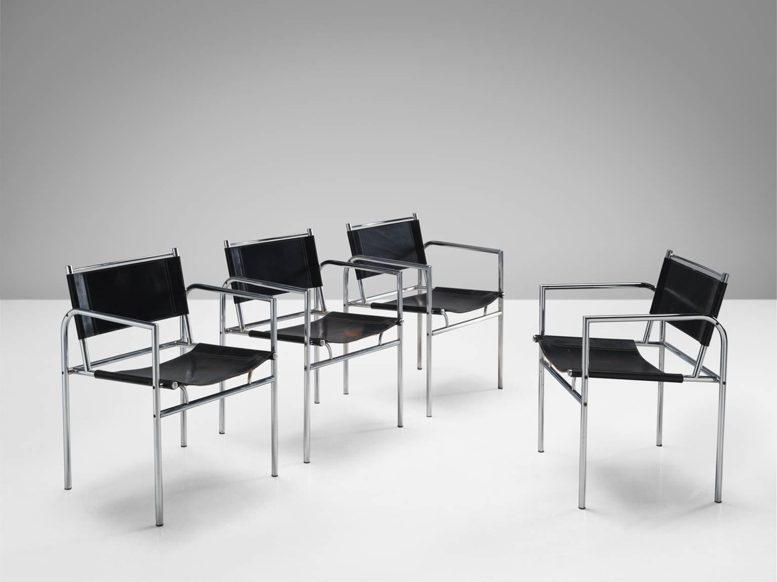 Armchairs, in stainless steel and leather, Netherlands, 1960s. 

Set of four black leather chairs with metal tubular steel. This set is characterized by clear lines and the use of metal in combination with the black natural material. The frame of