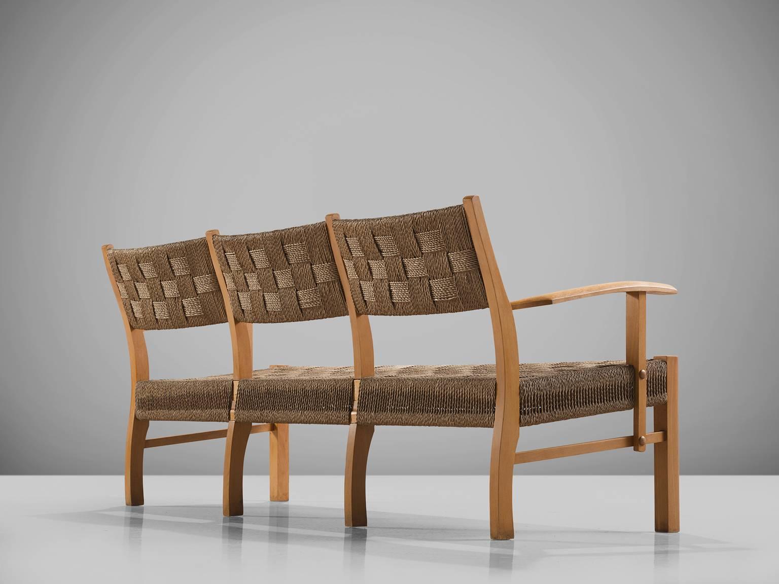 Three-seat sofa, in beech and seagrass, Denmark, 1950s.

Elegant wooden sofa with back and seating of braided seagrass rope. The frame of this sofa is made of solid beech and has a very nice and warm blond color. The back-legs and armrests show