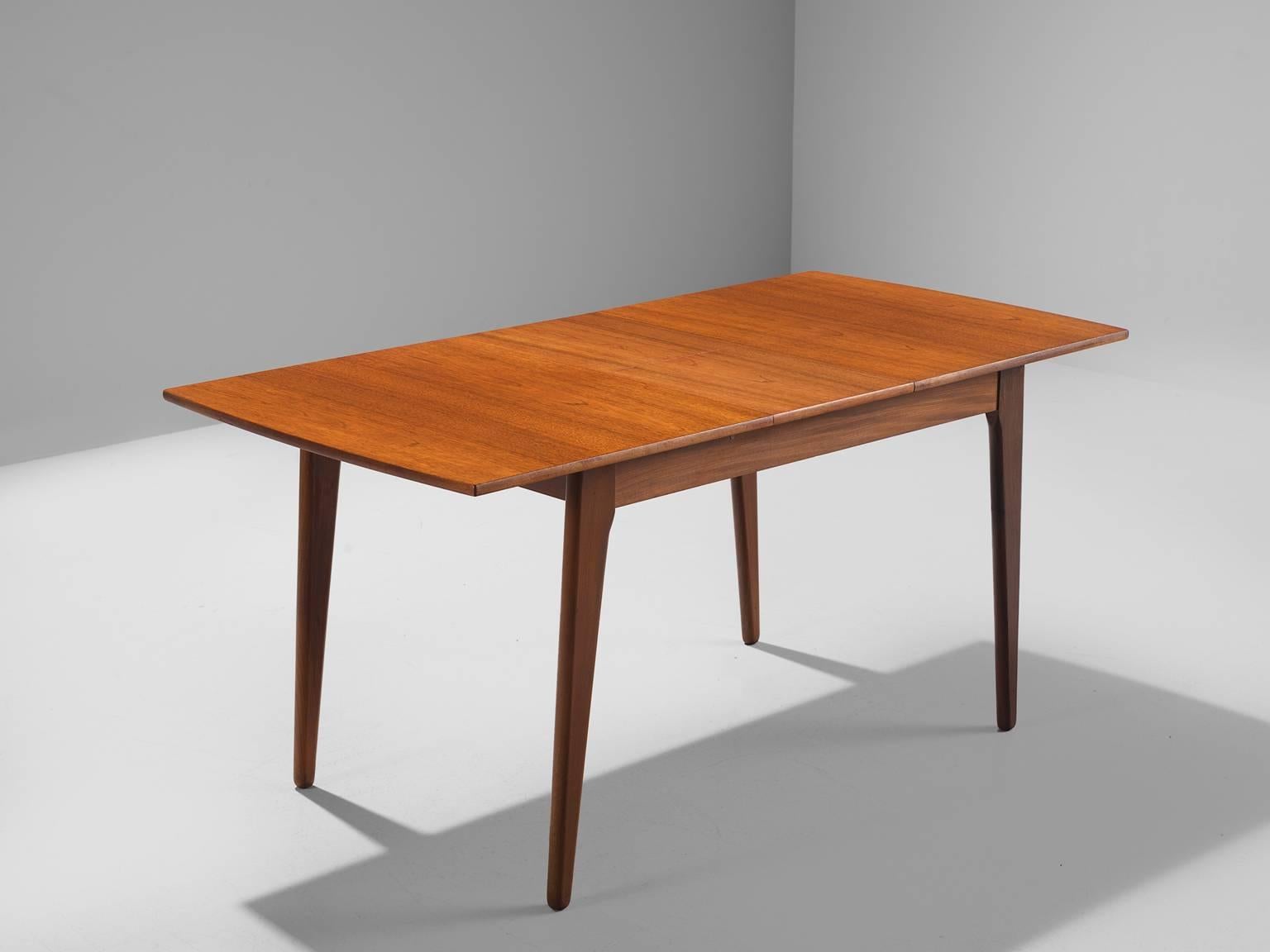 Dining or kitchen table, teak, Denmark, 1950s

This table is made from teak and has two extra leaves and can thus be extendable to a table for four people. The grain and flames in the table give this otherwise modest and simple table a very warm