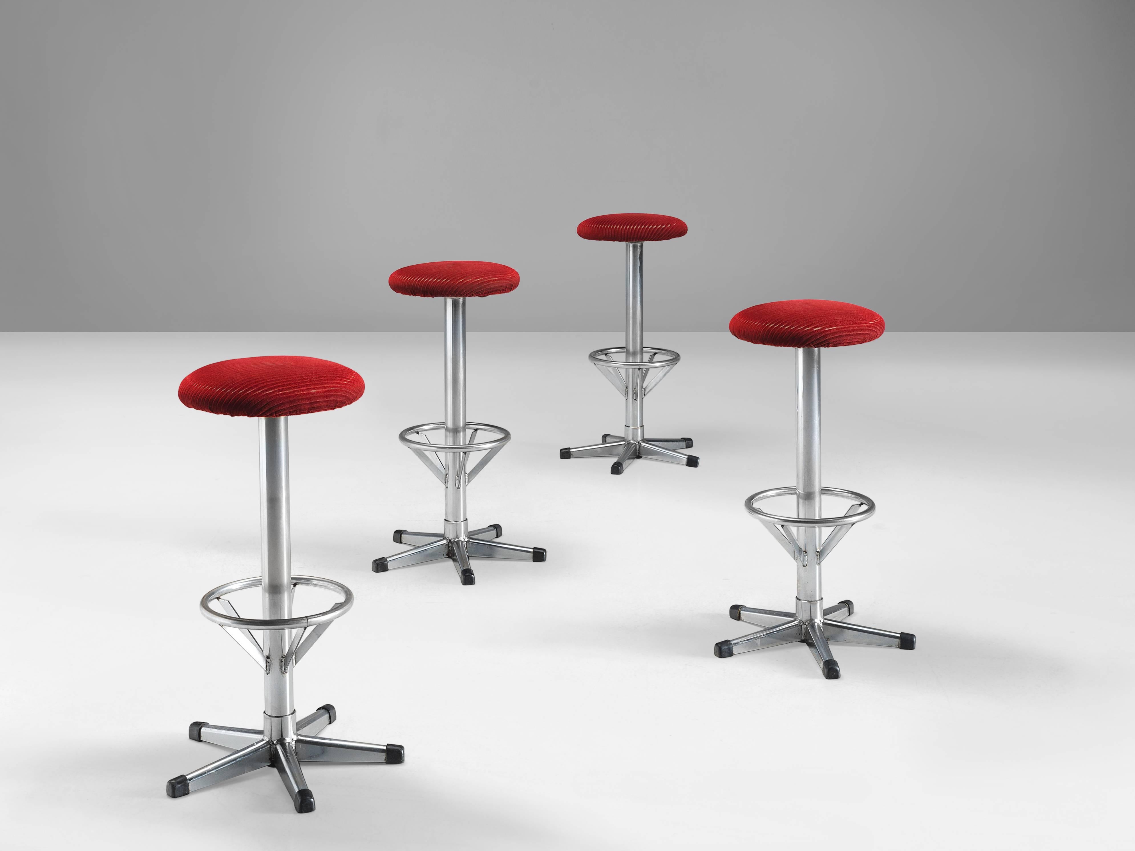 Bar stools, metal, velvet, Europe, 1970s.

Highly comfortable high barstools in red velvet upholstery. Due to the soft seat and back, these chairs provide a very pleasant seating comfort. The five-legged footrest emphasizes the functional design.