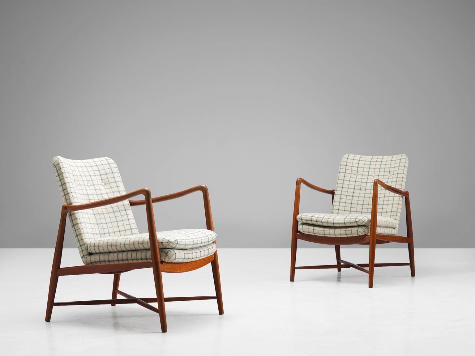 Finn Juhl for Bovirke, armchairs model 'BO-59', teak and white, black and blue checked fabric, Denmark, design 1954, production 1950s.

These armchairs are designed by Finn Juhl and produced by Bovirke. The chairs show the aesthetic