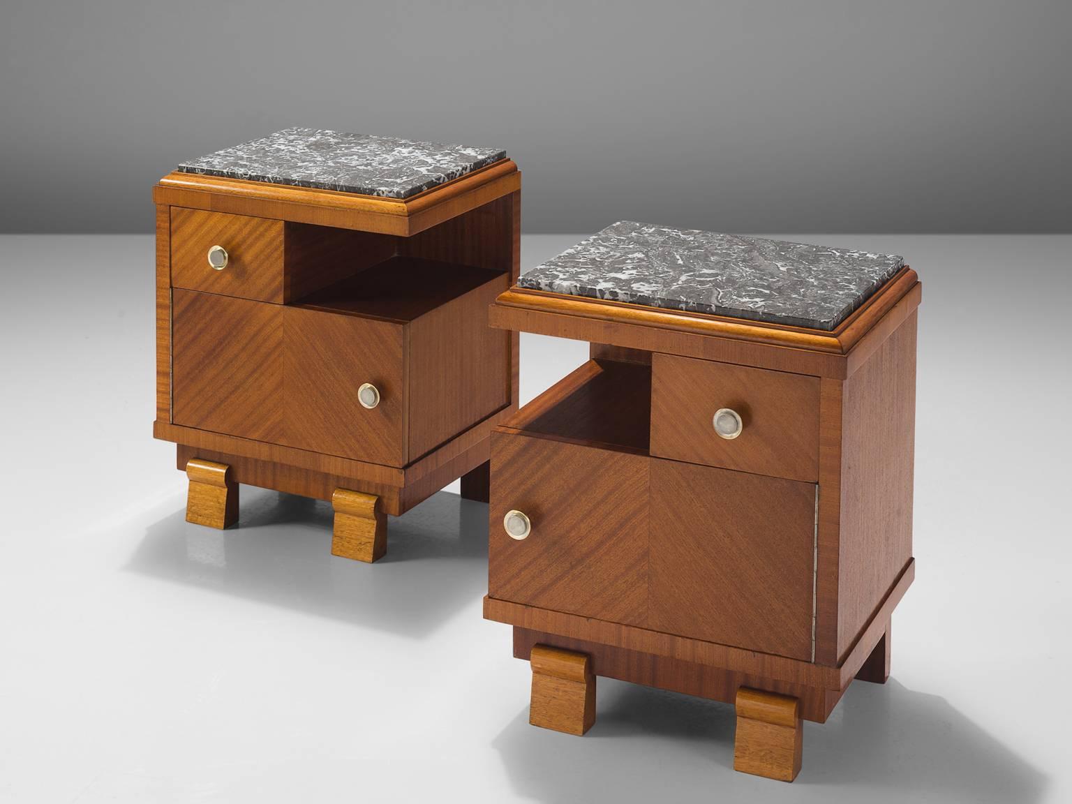 Set of two small cabinets, in mahogany and stone, Europe, 1930s. 

These two Art Deco nightstands are executed in mahogany and have a grey stone slab with white veins. The mahogany veneer is placed in different angles, which results in a geometric