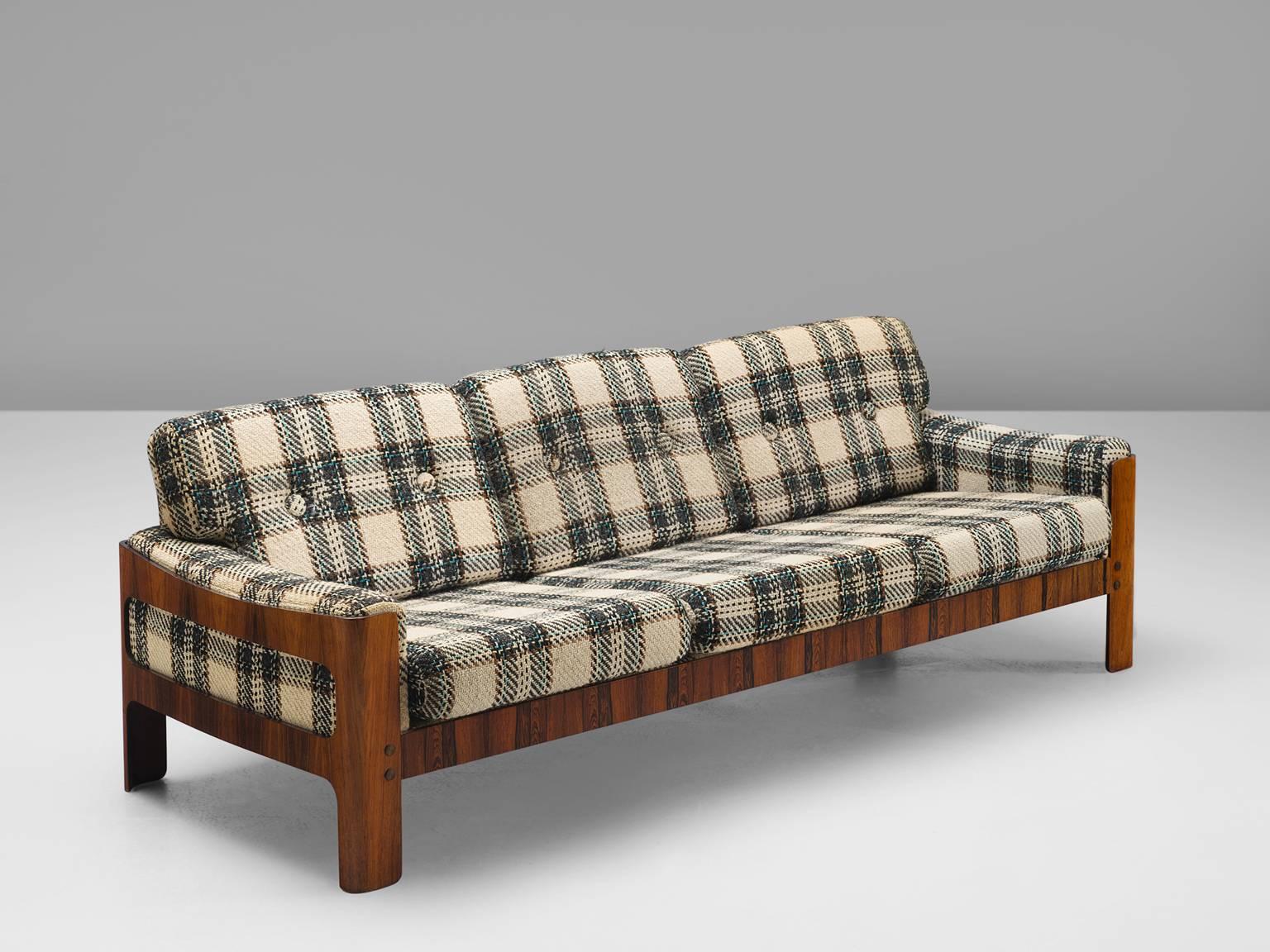 Sofa, rosewood, wool, Denmark, 1950s.

This sofa exists of a rosewood basket with thick comfortable woolen cushions. Robust and comfortable sofa. This three-seat sofa is strong and simplistic at the same time. The warm grains of the rosewood that