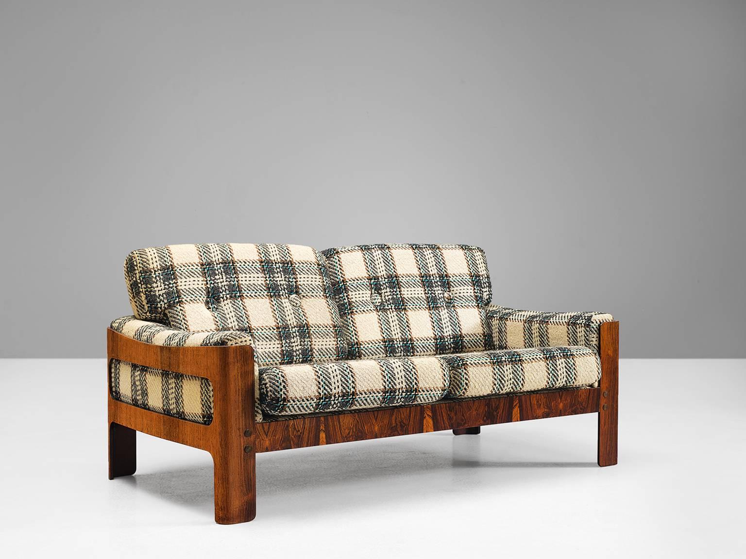 Sofa, rosewood, wool, Denmark, 1950s.

This sofa exists of a rosewood basket with thick comfortable woolen cushions. Robust and comfortable sofa. This three-seat sofa is strong and simplistic at the same time. The warm grains of the rosewood that