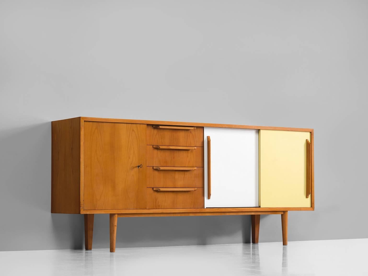 Sideboard for Van den Berghe-Pauvers, wood, formica, 1950s.

This Belgian sideboard is produced by Van den Berghe-Pauvers. Exquisite detail is the black and white blocked front of the shelves that form a strong graphic pattern. The blond cherry