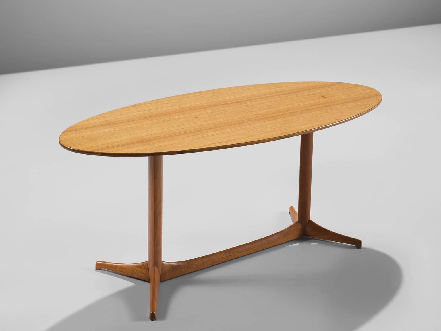 Kerstin Hörlin-Holmquist for Nordiska Kompaniet, Plommonet coffee table, mahogany, Sweden, 1950s. 

This oval mahogany side table is executed with a solid biomorphic trestle leg. The oval table features a slim top and is very well balanced with