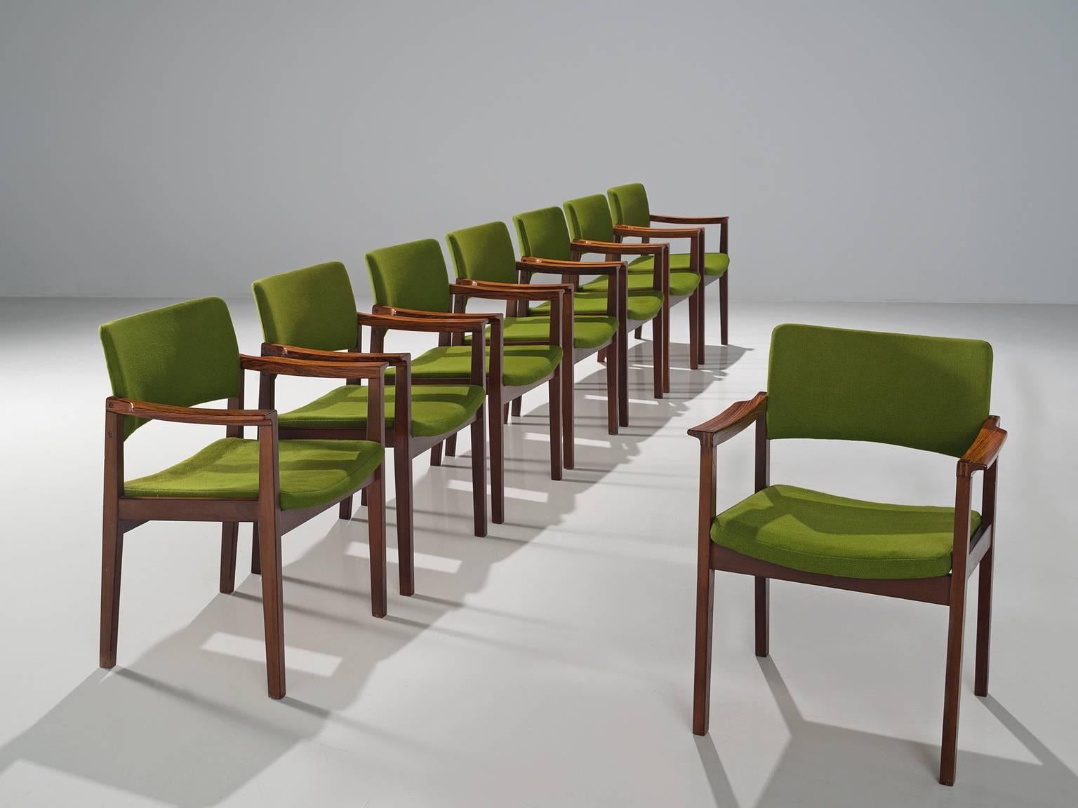 Set of eight dining chairs for Høngstole, green fabric and rosewood, Denmark, 1950s.
 
These solidly constructed rosewood chairs show elegant lines and stunning wood connections. This set of eight shows the Danish design at its best. The visually