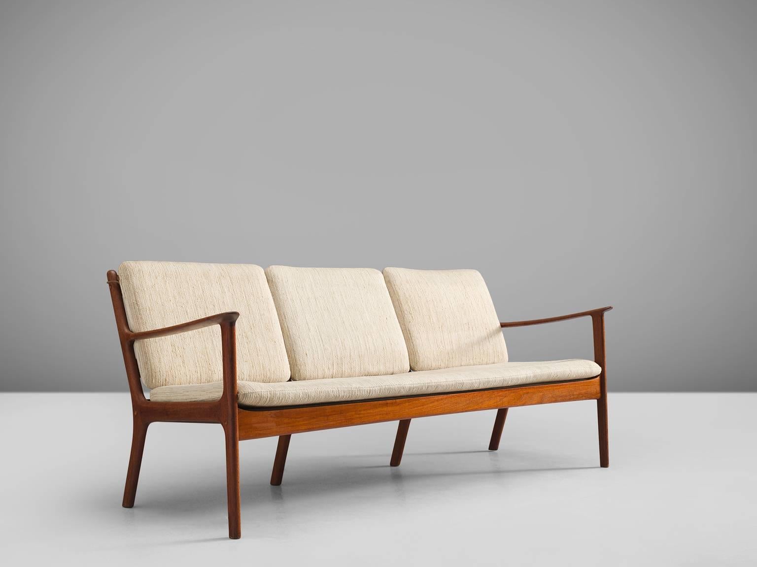 Kaj Winding, settee, teak, white to beige fabric, Denmark, 1950s.

This delicate Danish three-seat sofa is designed by Kaj Winding. The frame shows elegant lines, especially in the armrests. The sofa is executed with tilted back, by means of which