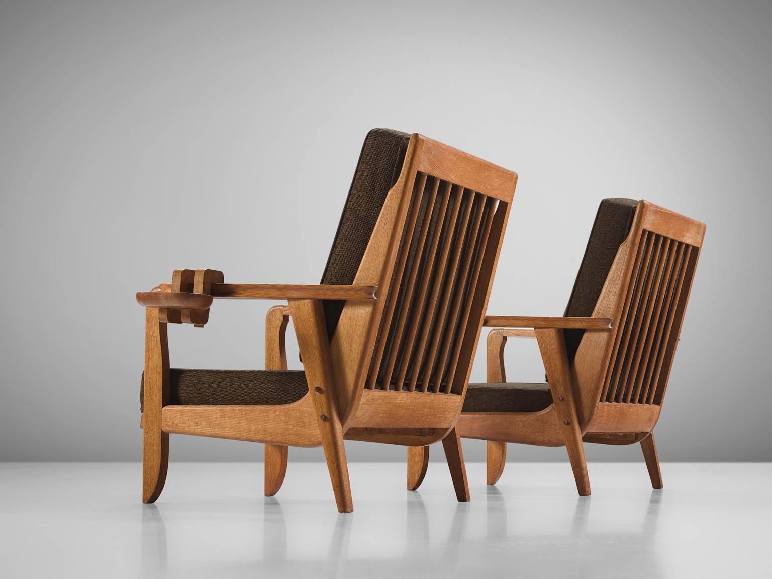 Jacques Chambron and Robert Guillerme, easy chairs, brown fabric, oak, France, 1950s

This sculptural set of easy chairs by Guillerme and Chambron is very well executed and made out of solid, carved oak. This set of comfortable armchairs feature