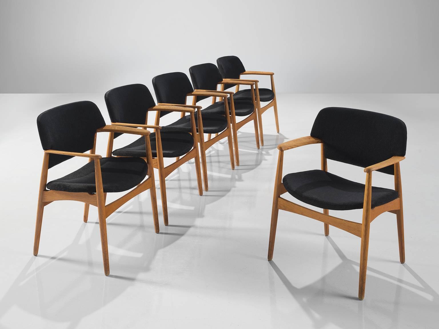 Aksel Bender Madsen for Fritz Hansen, oak and black fabric, Denmark, circa 1955

These wide dining chairs are executed with a rounded back. The chairs feature a blond oak frame that forms a great colour palette with the black fabric. The chairs are