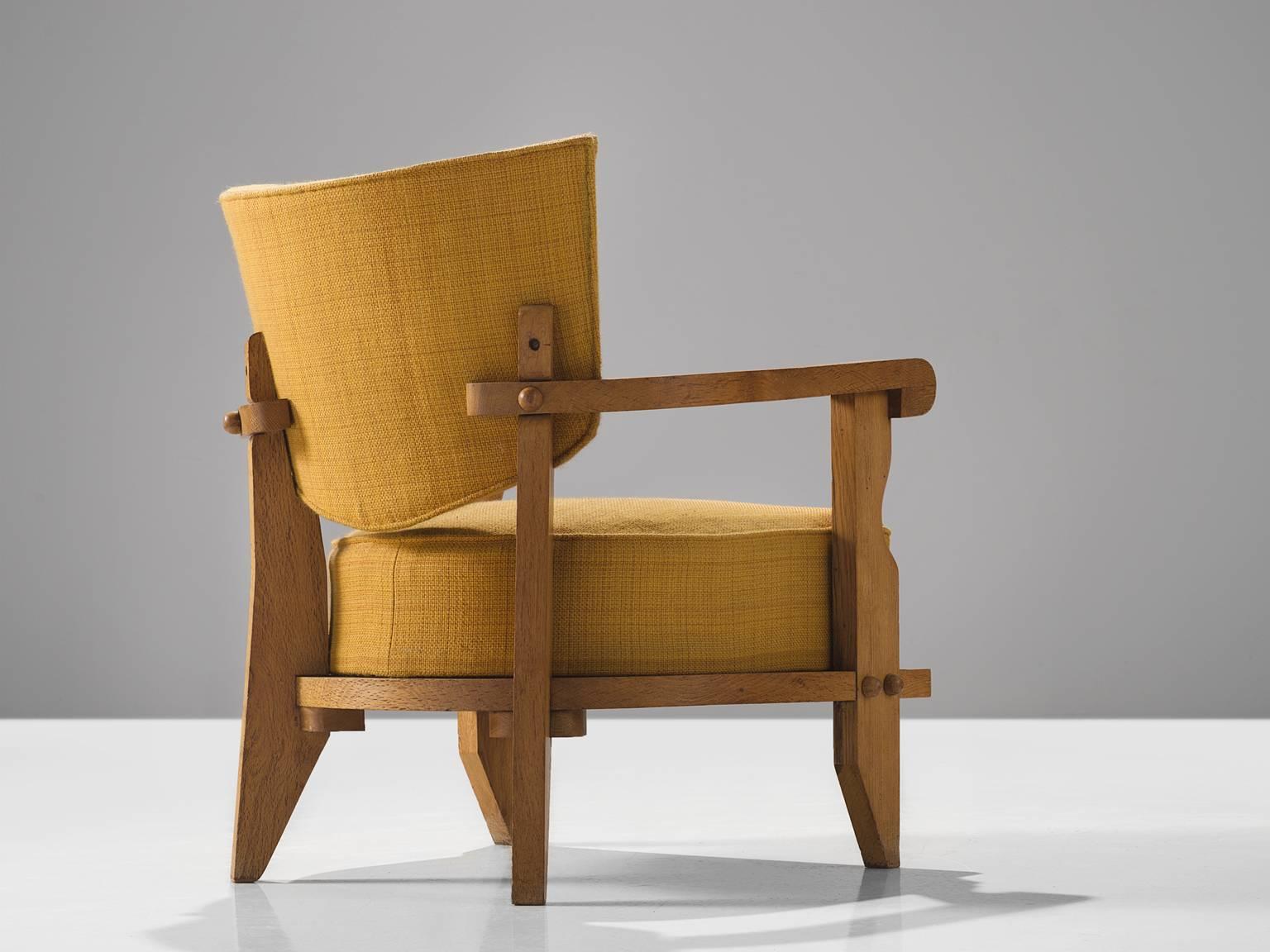 Jacques Chambron and Robert Guillerme, easy chair, yellow fabric, oak, France, 1950s

This sculptural easy chair by Guillerme and Chambron is very well executed and made out of solid, carved blond oak. This comfortable armchair features an