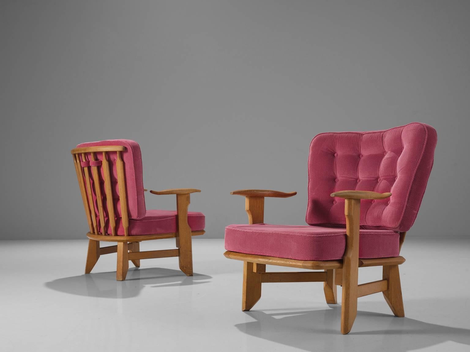 Guillerme and Chambron, pink fabric, oak, rope, France, 1950s

These sculptural easy chairs are designed by Guillerme and Chambron. They are known for their high quality solid oak furniture, off which this is no exception. These comfortable