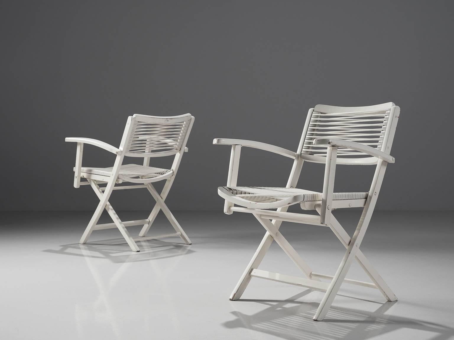 Chairs, white painted wood, Europe, 1960s.

These armchairs are made from wood that has been painted white. The seat and backrest is made of strings. Due to the use of this flexible material the chairs are comfortable as they adjust to the sitters