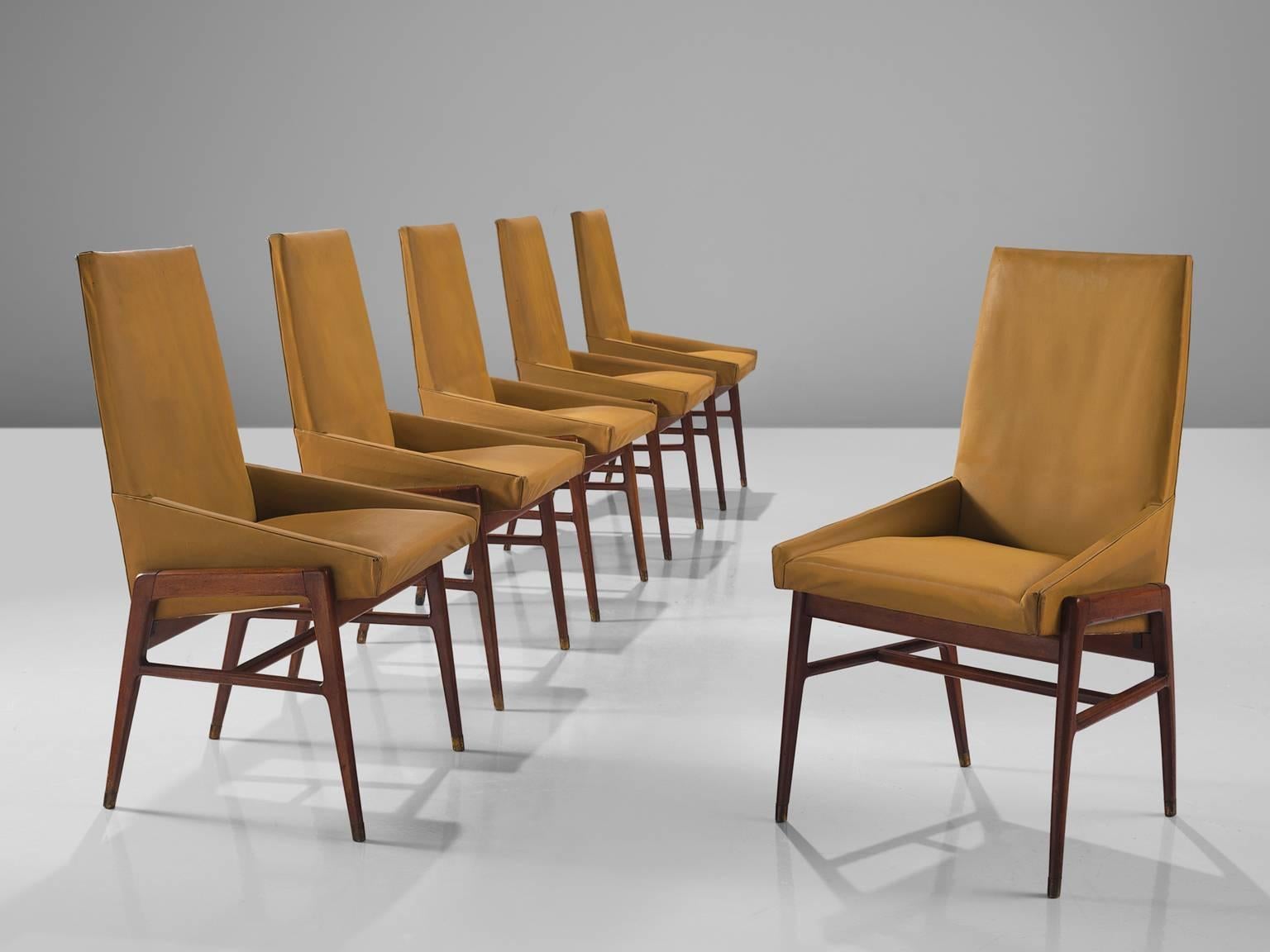 Dining chairs, walnut and ocre yellow faux leather, Italy, ca. 1950

These Italian dining chairs feature straight diagonal edges on the side of the seat and a high back. These majestic chairs have a walnut frame with a beautiful visible grain that