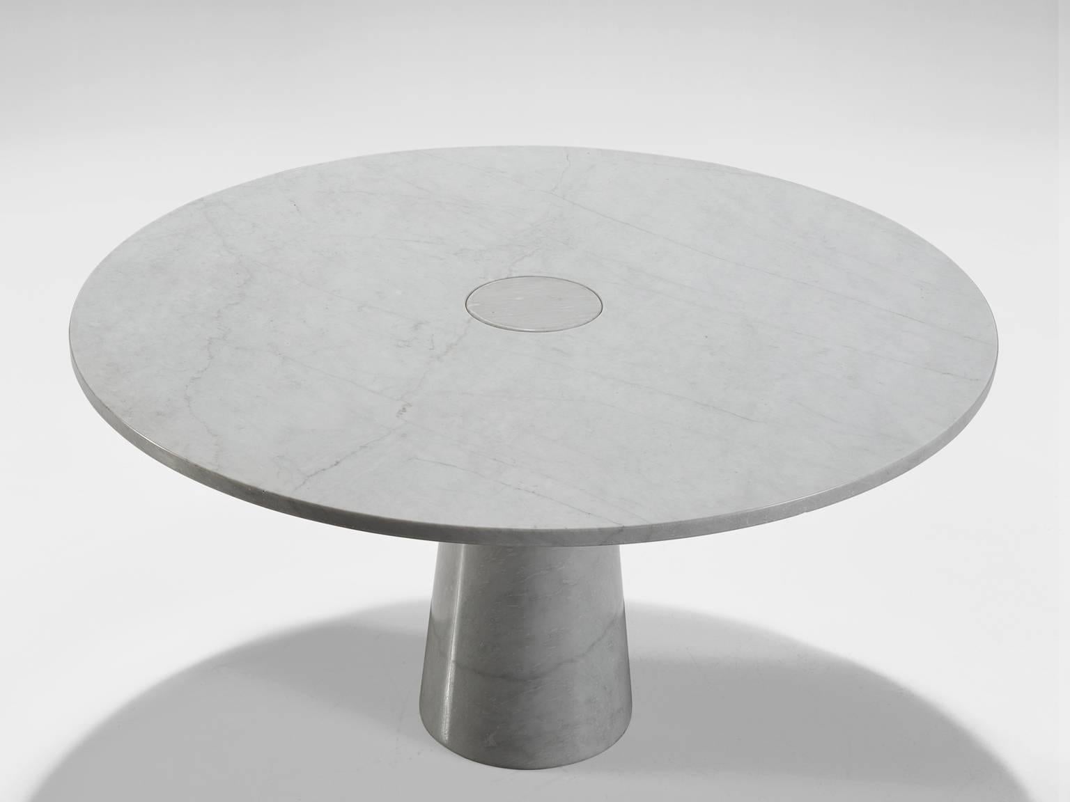 Angelo Mangiarotti, 'Eros' dining table, marble, Italy, 1970s. 

This architectural table is a skilful example of postmodern design. The circular table features no joints or clamps and is architectural in its structure featuring one single column