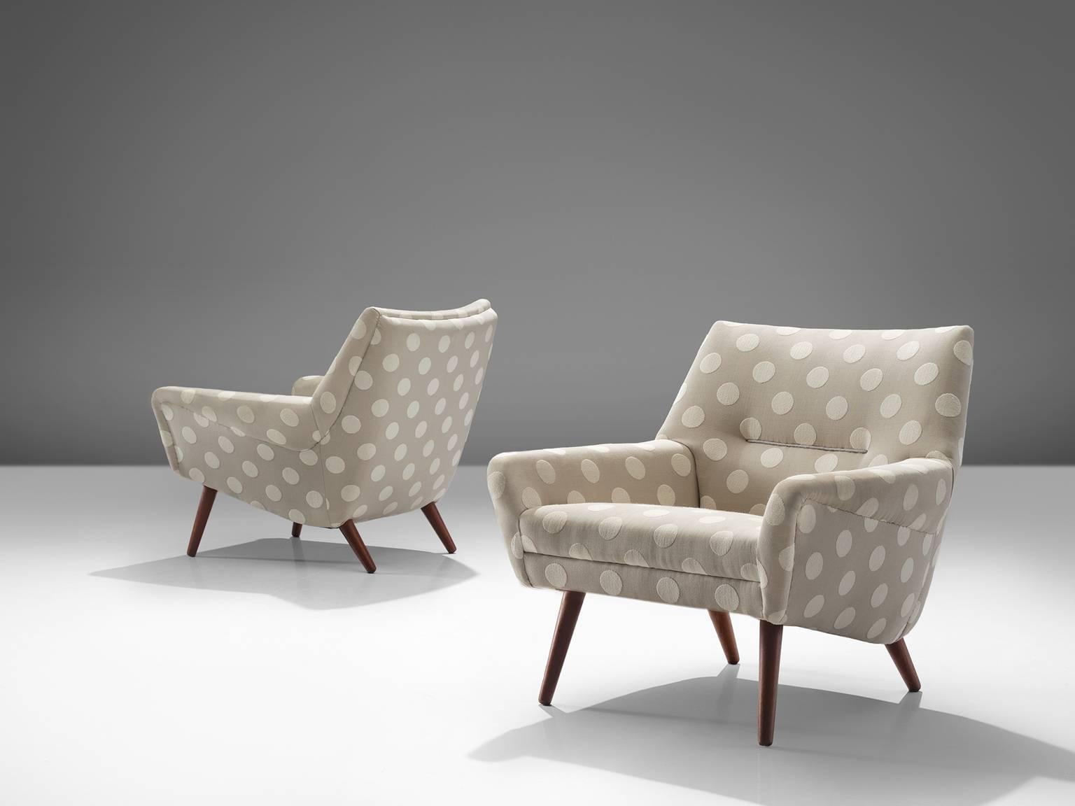 Easy chairs, grey and white dotted fabric, teak, Denmark, 1960s.

These armchairs show refined Danish craftsmanship and aesthetics. The backs feature a slightly tilted back and comfortable cushions in both the seat and back, as can be expected