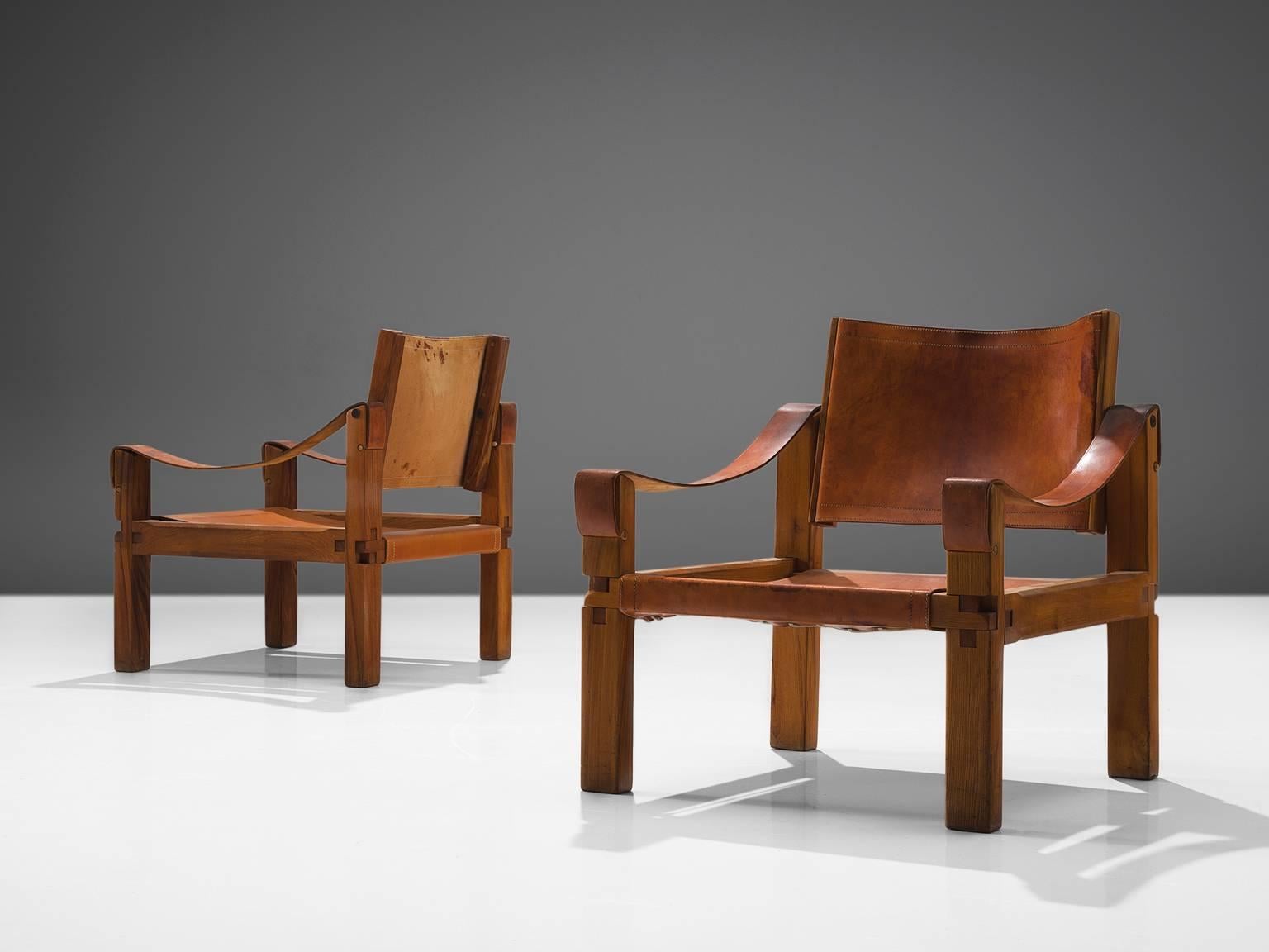 Pierre Chapo, two armchairs, model S10X, elm and leather, France, ca. 1964.

This set of two lounge chairs is designed by Pierre Chapo. These comfortable armchairs in solid elmwood and cognac saddle leather of this specific set features a wonderful