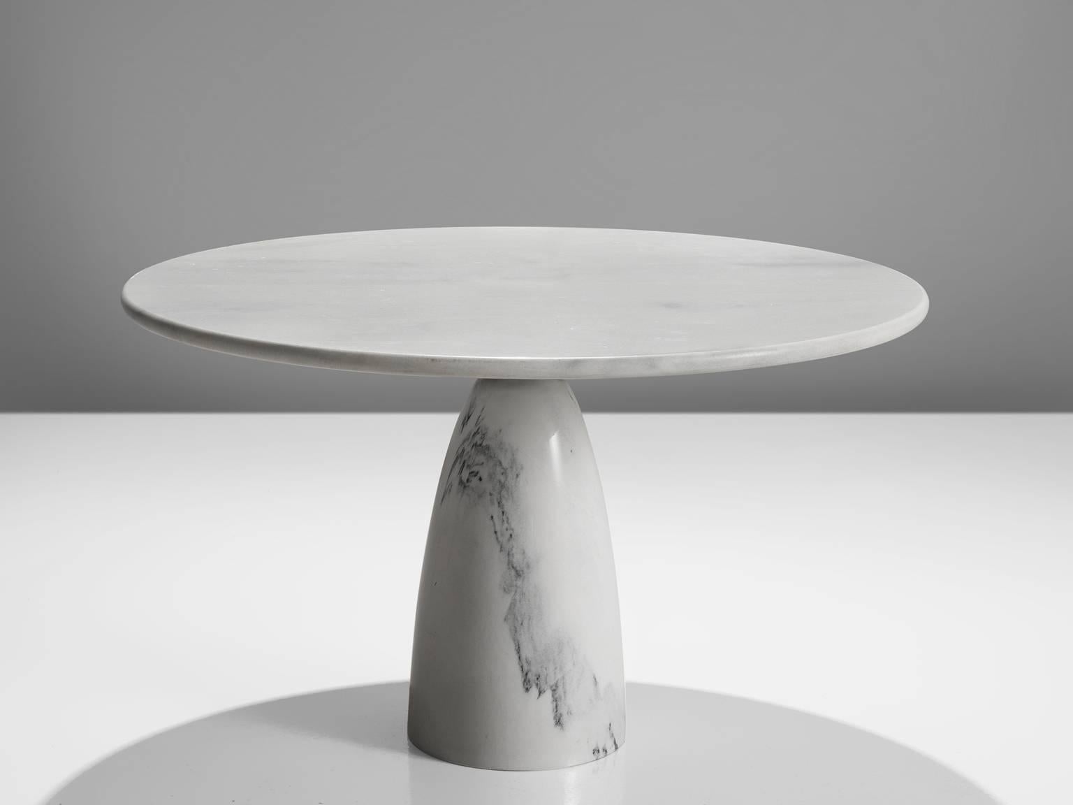 Dining table, white marble, metal, Germany, circa 1972.

This strong center table features a colon foot and a thick circular tabletop. The aesthetics are archetypical for postmodern design, bearing references to architectural forms and without a