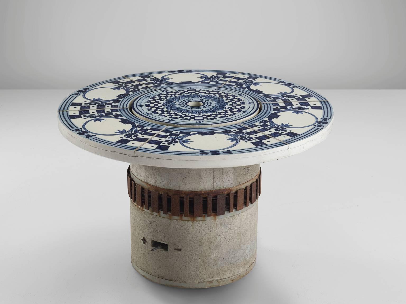 Bjørn Wiinblad, 'Hibachi' grill table, faience tiles and glazed concrete, metal, Denmark / Germany, 1970s.

This garden table is decorated with hand-painted ceramic tiles in blue and white. The centre features removable centre beneath which is the