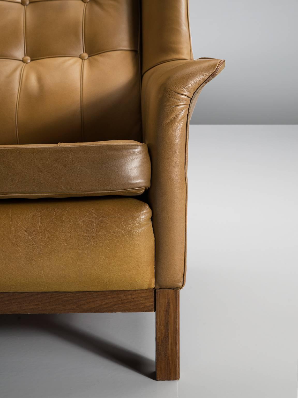 Mid-20th Century Arne Norell Matching Pair of High Back Chairs in Patinated Cognac Leather