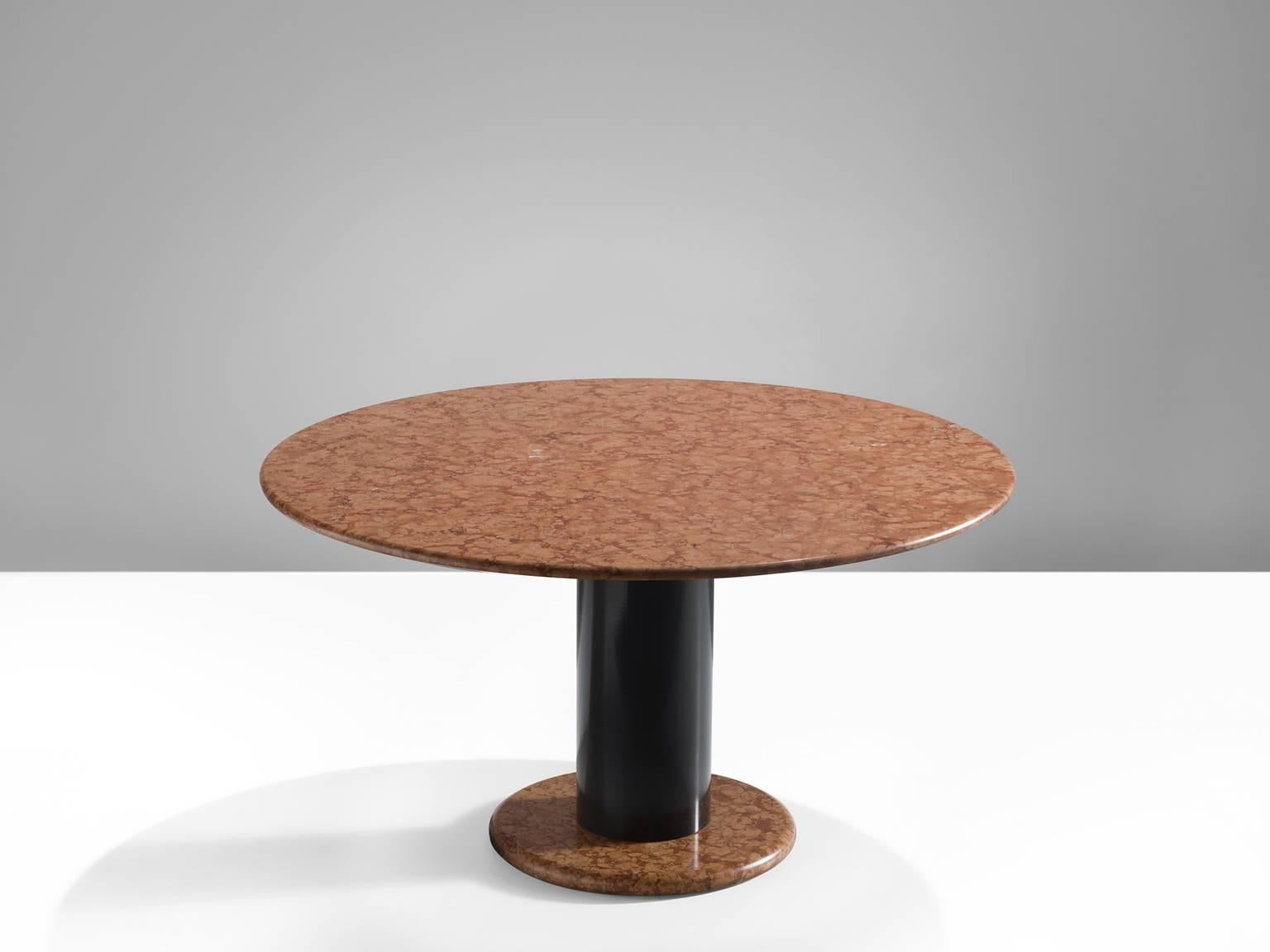 Table, in marble and metal, by Ettore Sottsass for Poltronova, Italy, 1965. 

Round pedestal table by Italian designer Ettore Sottsass. A orange-pink round base with black metal cylindrical column. The round top is executed in beautiful rose