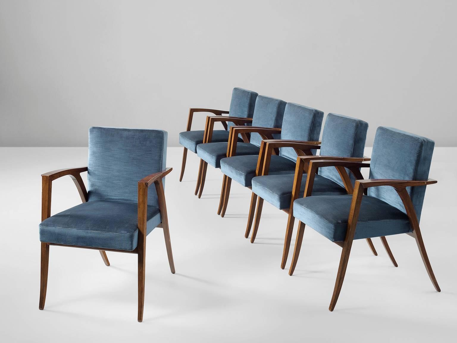 Set of six dining chairs, in rosewood and blue fabric, Italy, 1950s.

Six elegant dining room chairs in rosewood and blue upholstery. These small armchairs have a very elegant design with nicely tapered (almost saber) legs. The horizontal armrests