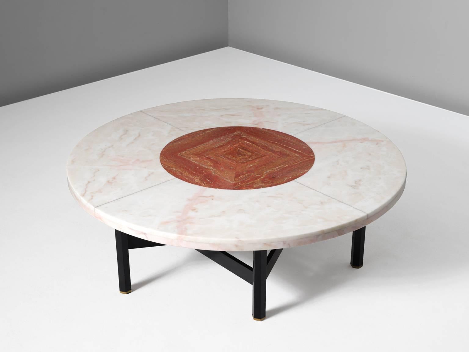 Cocktail table, in wood, marble, travertine and brass by Jan Vlug / Jules Wabbes, Belgium, 1970s.

Exclusive coffee table with characteristic graphical base and round stone top. The base, made of dark lacquered wood, consists of six legs, formed
