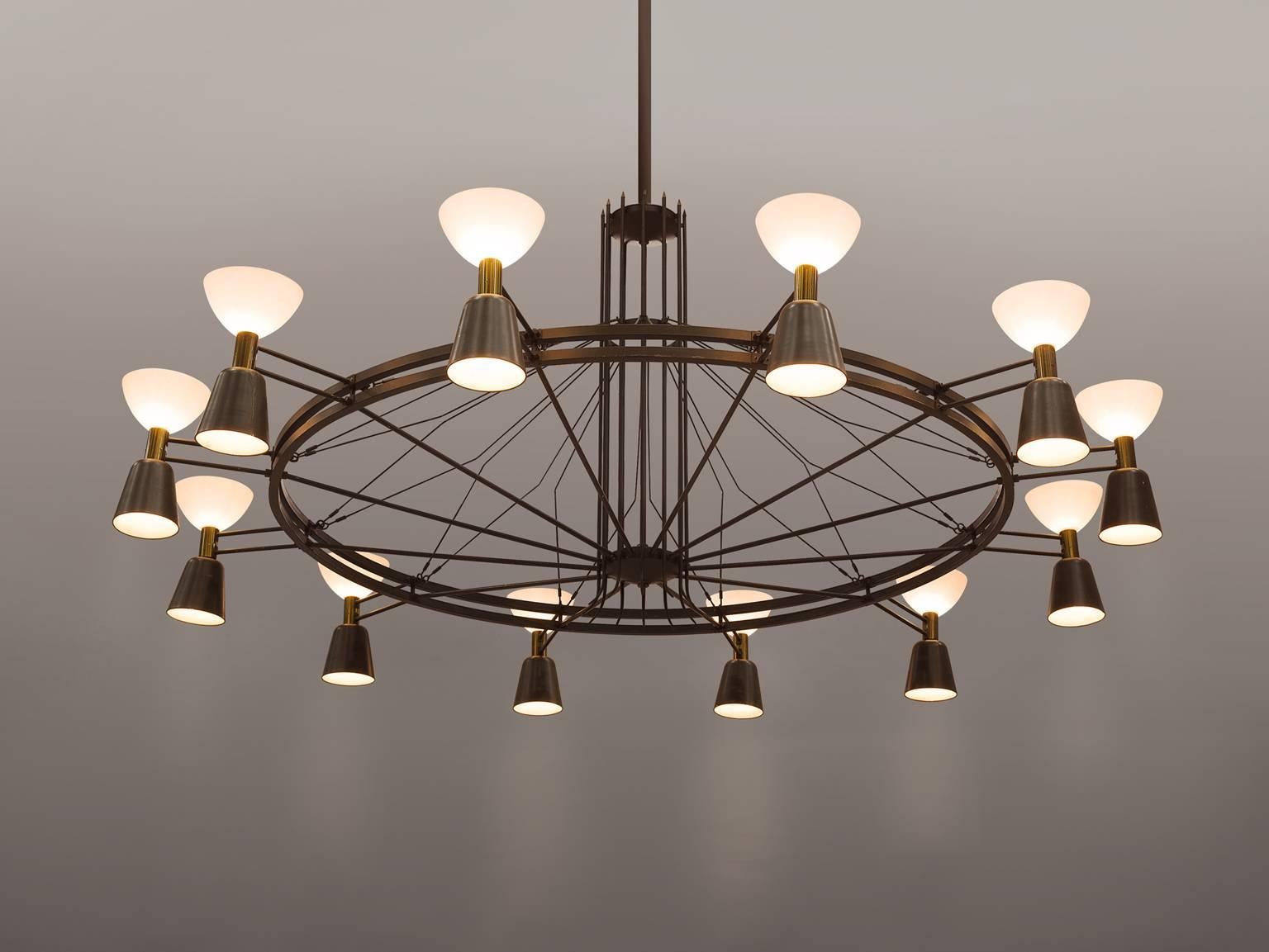 Chandelier, metal, glass The Netherlands, circa 1950.

This large Dutch chandelier is made in the 1950s by a local designer in the Eastern region of the Netherlands. The chandelier features twelve shades that shine both upwards and downwards. The
