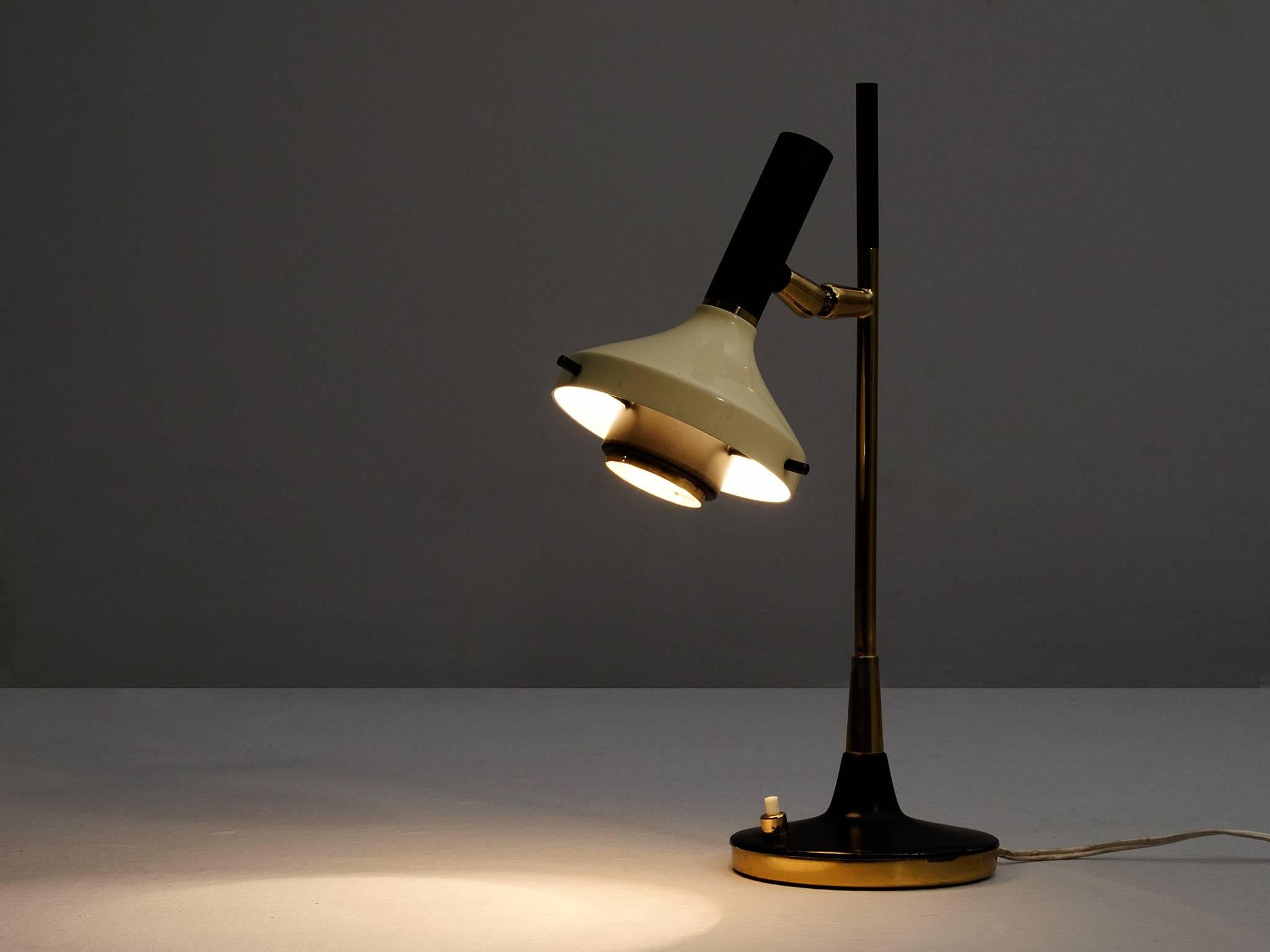 Oscar Torlasco, table lamp, metal and brass by Italy, 1950s. 

Refined small desk light by Italian designer Oscar Torlasco. The light consist of a round base in black coated metal with brass bottom. The stern is also from bass with a black top.