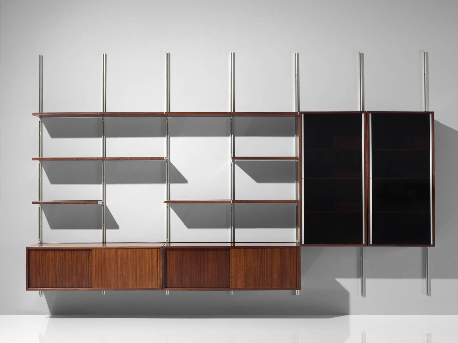 Osvaldo Borsani for Tecno, bookcase or wall unit, in metal and wood, Italy, 1950s.

This wall-mounted shelving unit is six sections large. The order and lay out of this unit is adjustable. According to Osvaldo Borsani the home needs to be orderly,