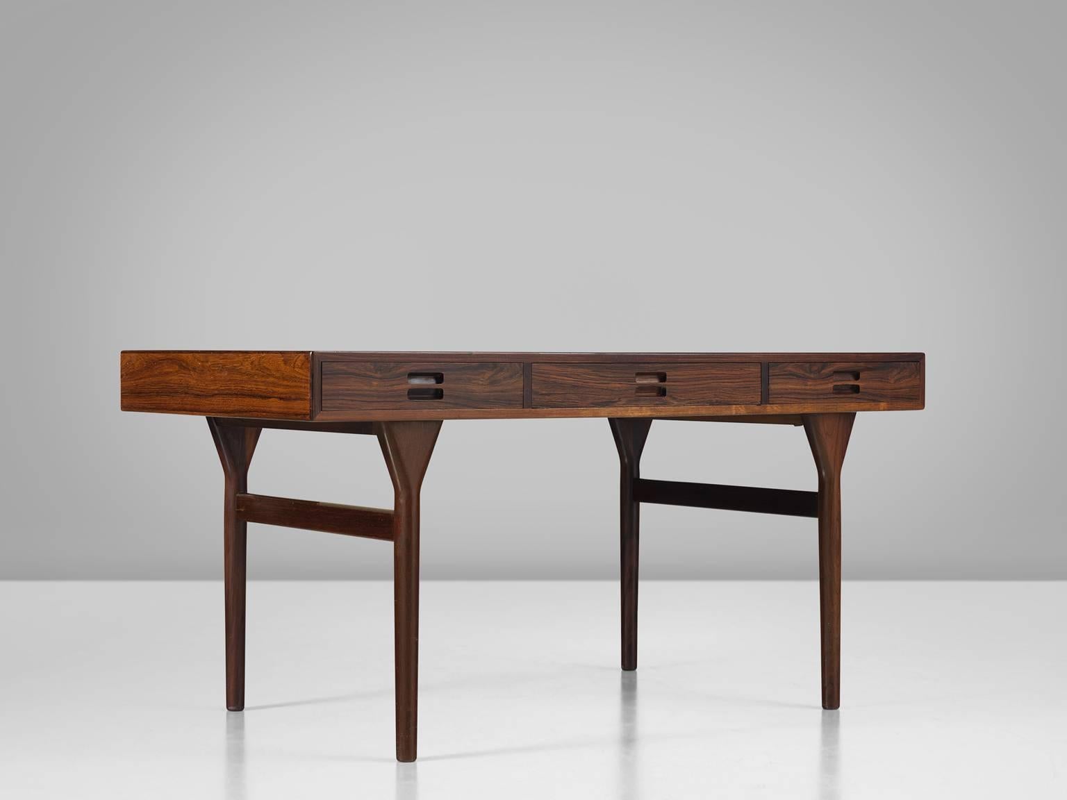 Nanna Ditzel for Søren Willadsen, desk, in rosewood, by Denmark, design 1958, production 1960s. 

Elegant designed freestanding desk designed by one of the best known Danish designers Nanna Ditzel. It creates it's strength and beauty due to simple