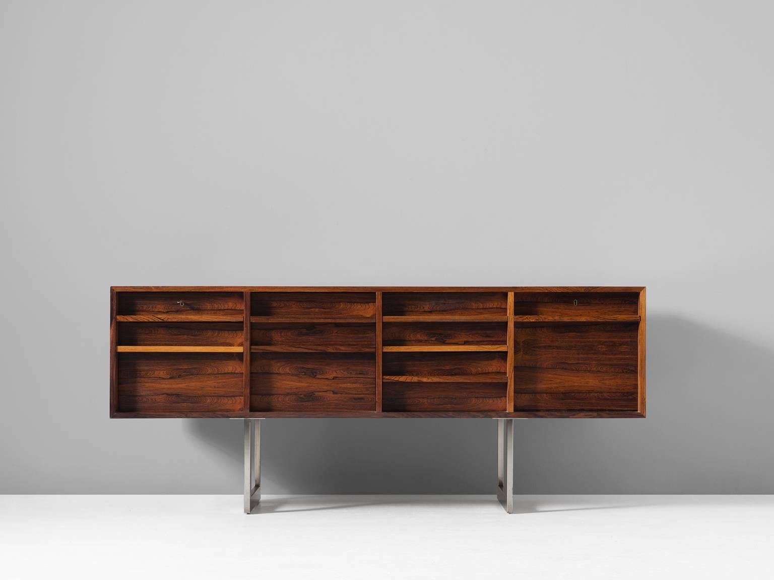 Bodil Kjaer, sideboard model 911, in rosewood and metal, by Denmark, designed 1959, this example manufactured 1960-70s. 

Freestanding sideboard in rosewood by Danish designer Bodil Kjaer. Absolute stunning credenza. This cabinet shows an
