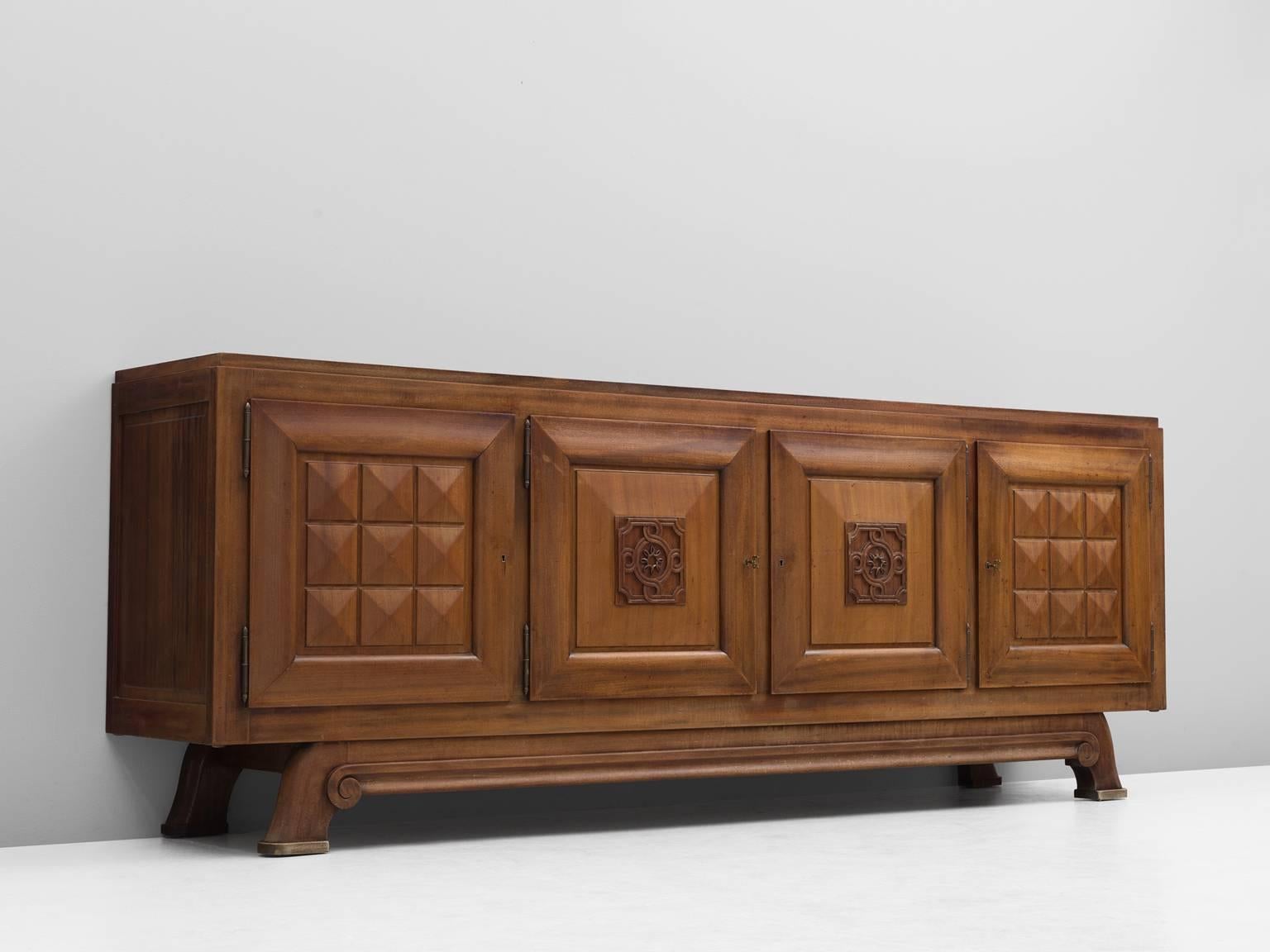 Gaston Poisson, credenza in mahogany, France, 1930s.

Sturdy credenza in with graphical door panels and parquet top. This four-door sideboard is equipped with several shelves and drawers which provide plenty of storage space. The shelves are