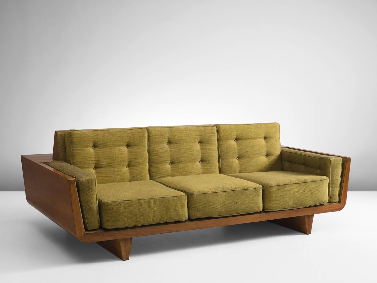 Sofa, walnut wood with green fabric, Italy, circa 1950.

This sculptural sofa is executed with walnut and has several removable cushions that are covered in a green fabric. The frame of the sofa is geometric and has pyramid legs that work well