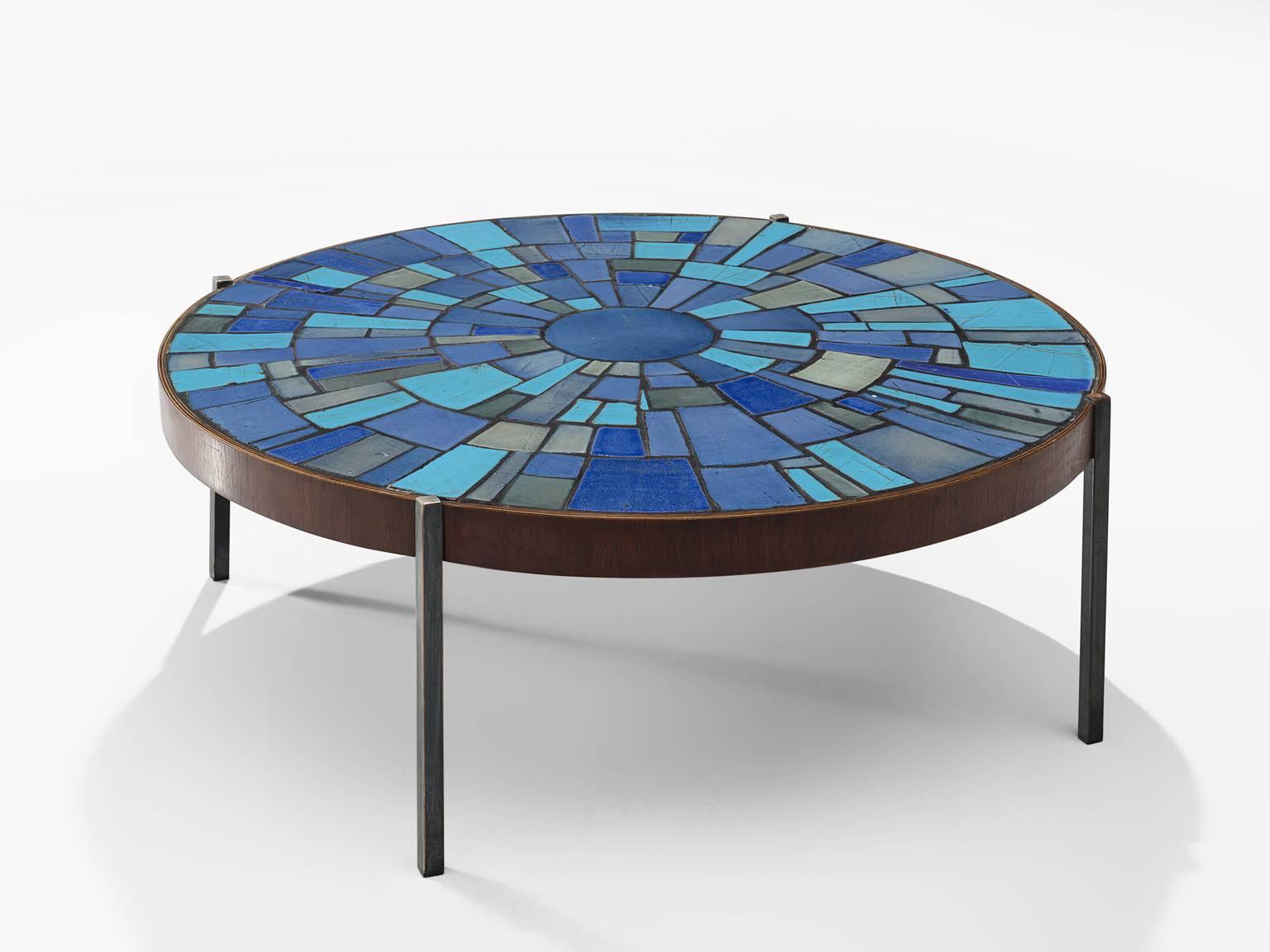 Rogier Vandeweghe for Amphora, cocktail table, blue ceramic, wood, iron, Belgium, circa 1950

This inlayed mosaic round coffee table displays a vivid colour scheme of different blues. Ranging from aquamarine to soft grey, the table is vivid and