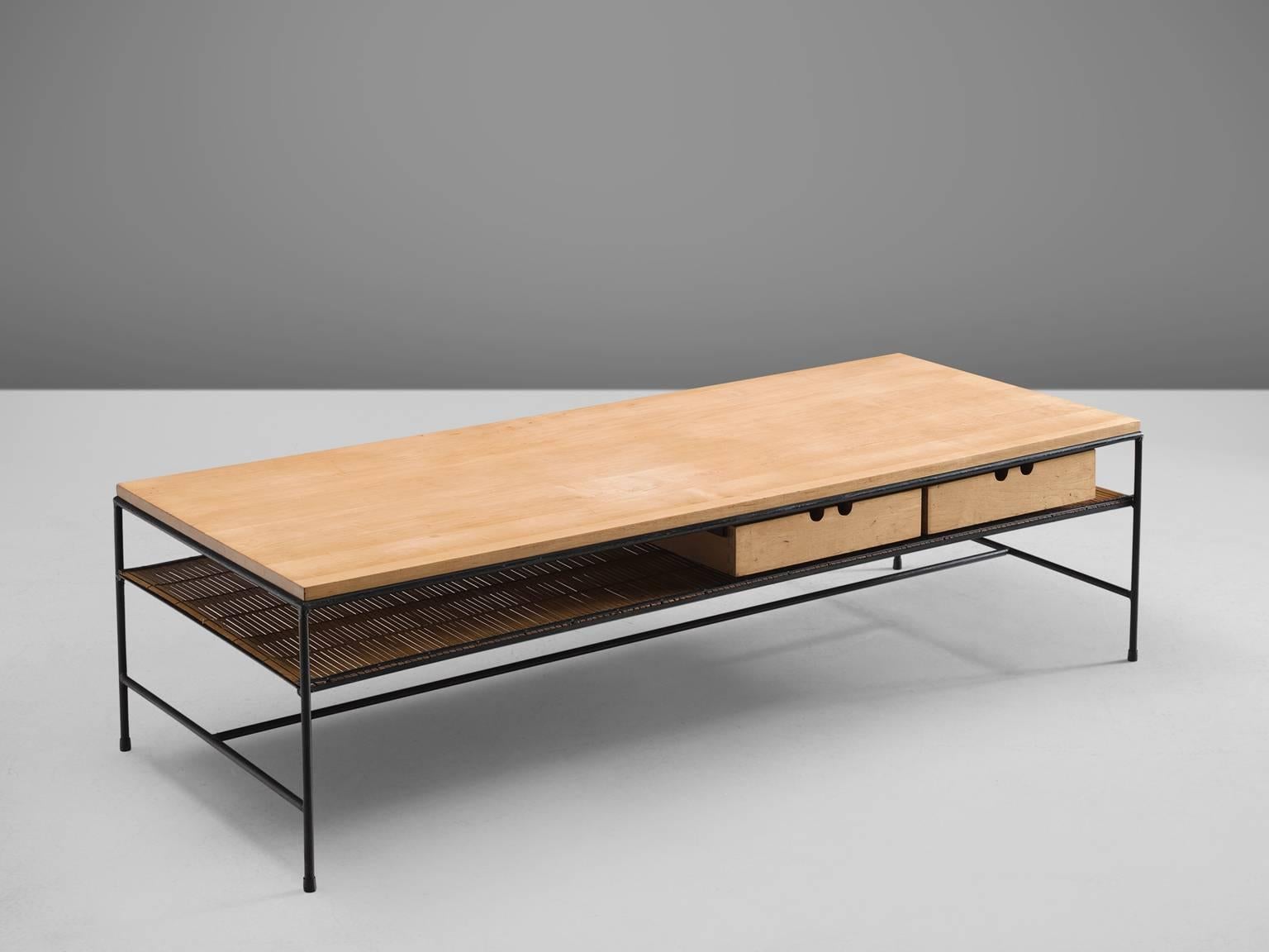 Paul McCob by Winchendon Furniture Company, coffee table, black lacquered metal, bamboo, United States, 1950s. 

This slender yet solid coffee table by Paul McCobb is typical for midcentury design collection. This piece has a black coated metal