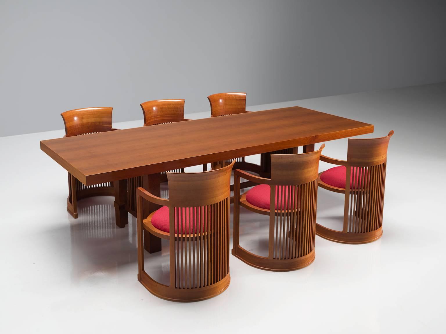 Frank Lloyd Wright for Cassina, 608 Taliesin table and six 'barrel' chairs, cherry, red fabric, design 1917, production 1989, United States,

This Taliesin table is designed by Frank Lloyd Wright and produced by Cassina. The table has an