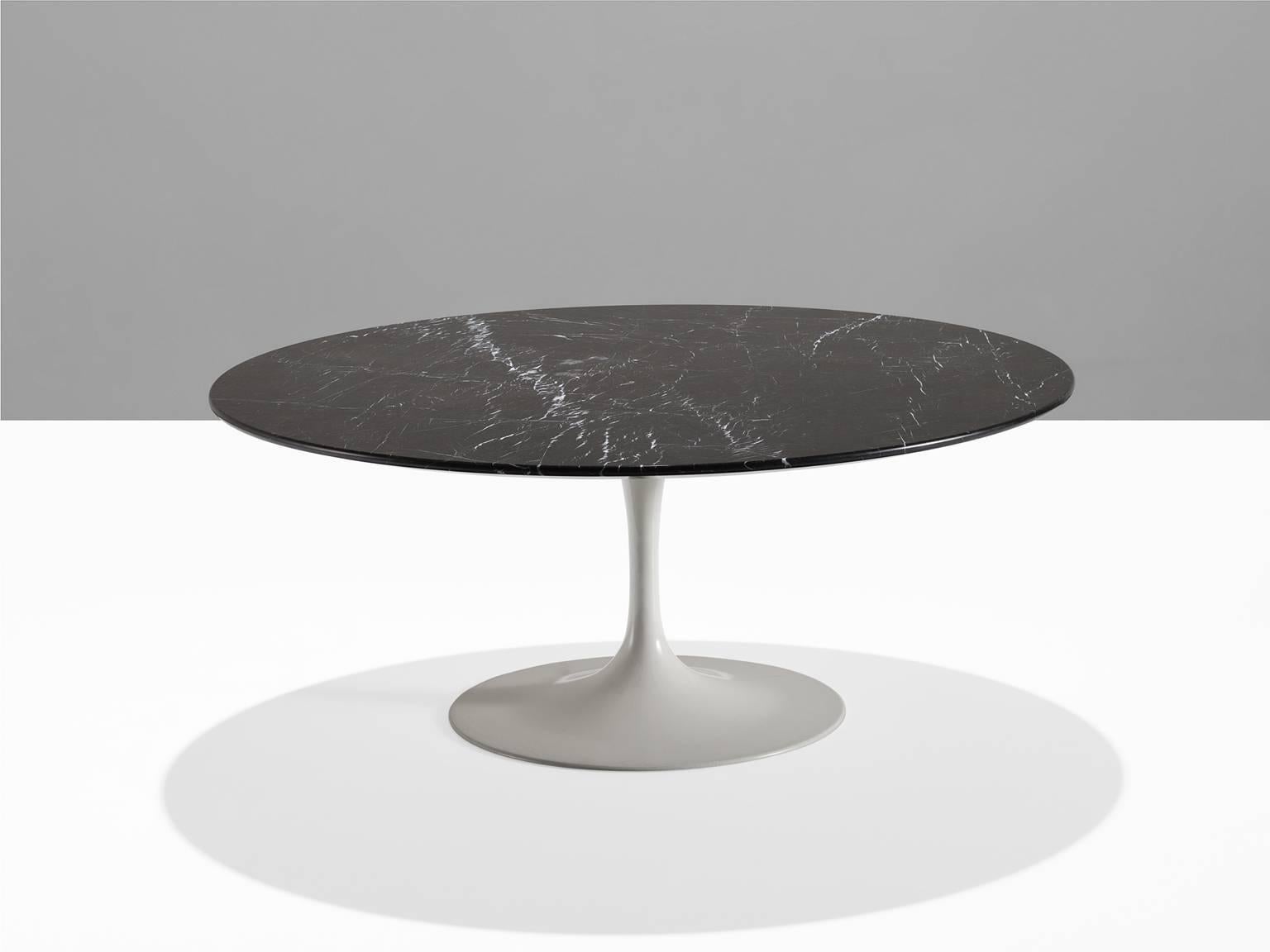 Cocktail table, Nero Marquina marble top, United States, 1957.

This round iconic tulip table is designed by Eero Saarinen in the fifties and it took him five years to arrive at this exact design. The table was designed to create peaceful