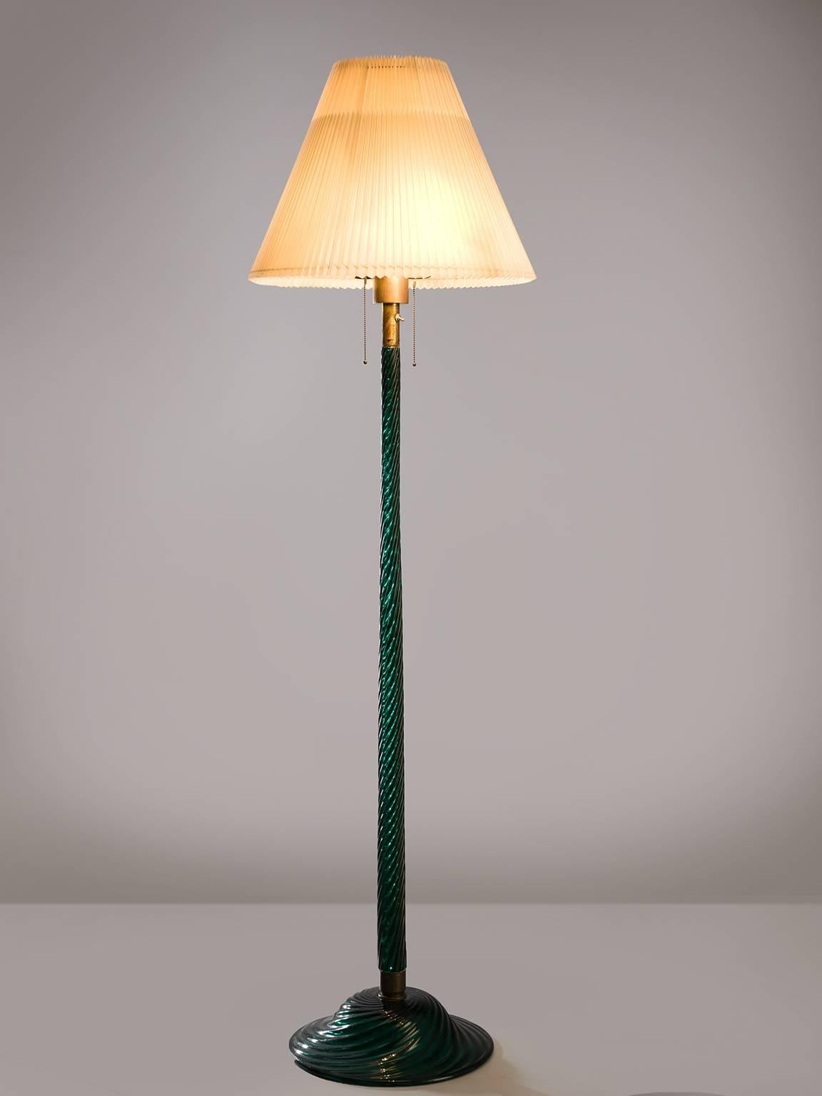 Venini floor lamp, glass, Italy, design 1934, production later.

This Classic floor lamp is executed in a wonderful clear color. The lamp has a ribbed, 'costelature' stem and base. Thanks to this artful skill this floor lamp is much more than a