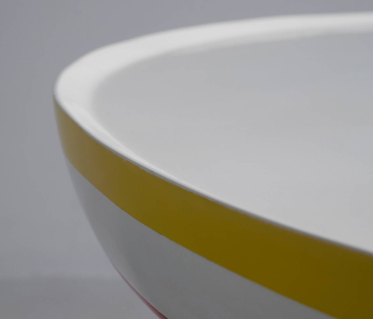 Table model Dulan, in polyester and glass, by Valentina Audrito, Italy, 2000s.

The round surface of the top as well as the base are decorative hand-painted.
The top is equipped with a round mirror. The colourful lines in various widths emphasise