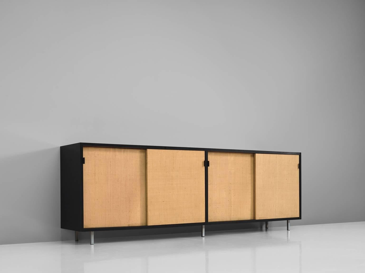 Florence Knoll for Knoll, cane, black ebonized wood, metal, cane, United States, 1961.

This sideboard is designed by Florence Knoll for Knoll International and was designed for the head office of a bank in Italy. The credenza is executed with