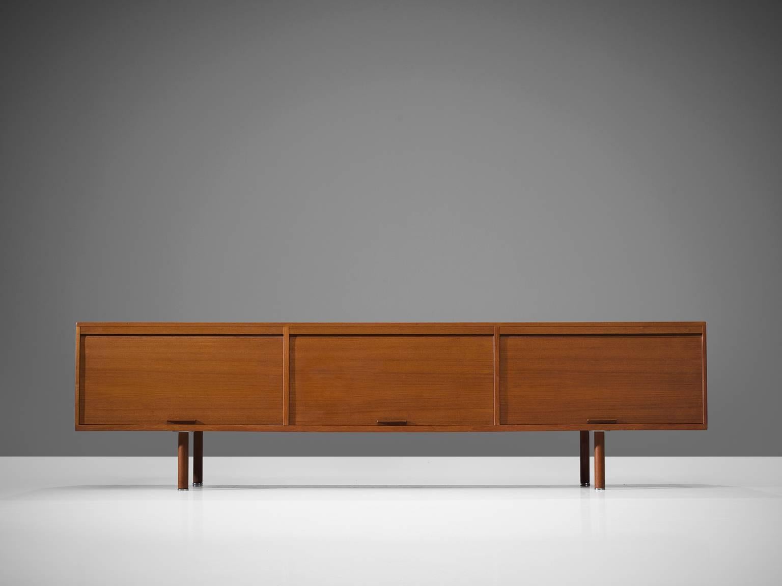 Kai Kristiansen, sideboard, white lacquer, chromed metal, Denmark, 1960s.

This relatively low sideboard is designed by Kai Kristiansen for Feldballes Møbelfabrik. The sideboard features three tambour doors and the interior features white lacquered