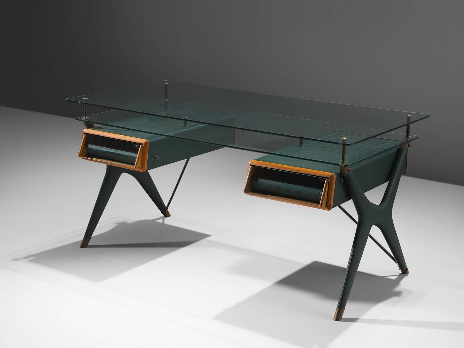 Silvio Berrone for Vitrex, desk in walnut, brass, glass and faux leather, Italy, 1950s.

This elegant desk is designed by the architect Silvio Berrone. He originally designed this desk as part of a larger range for Piedmontese coffeemakers company