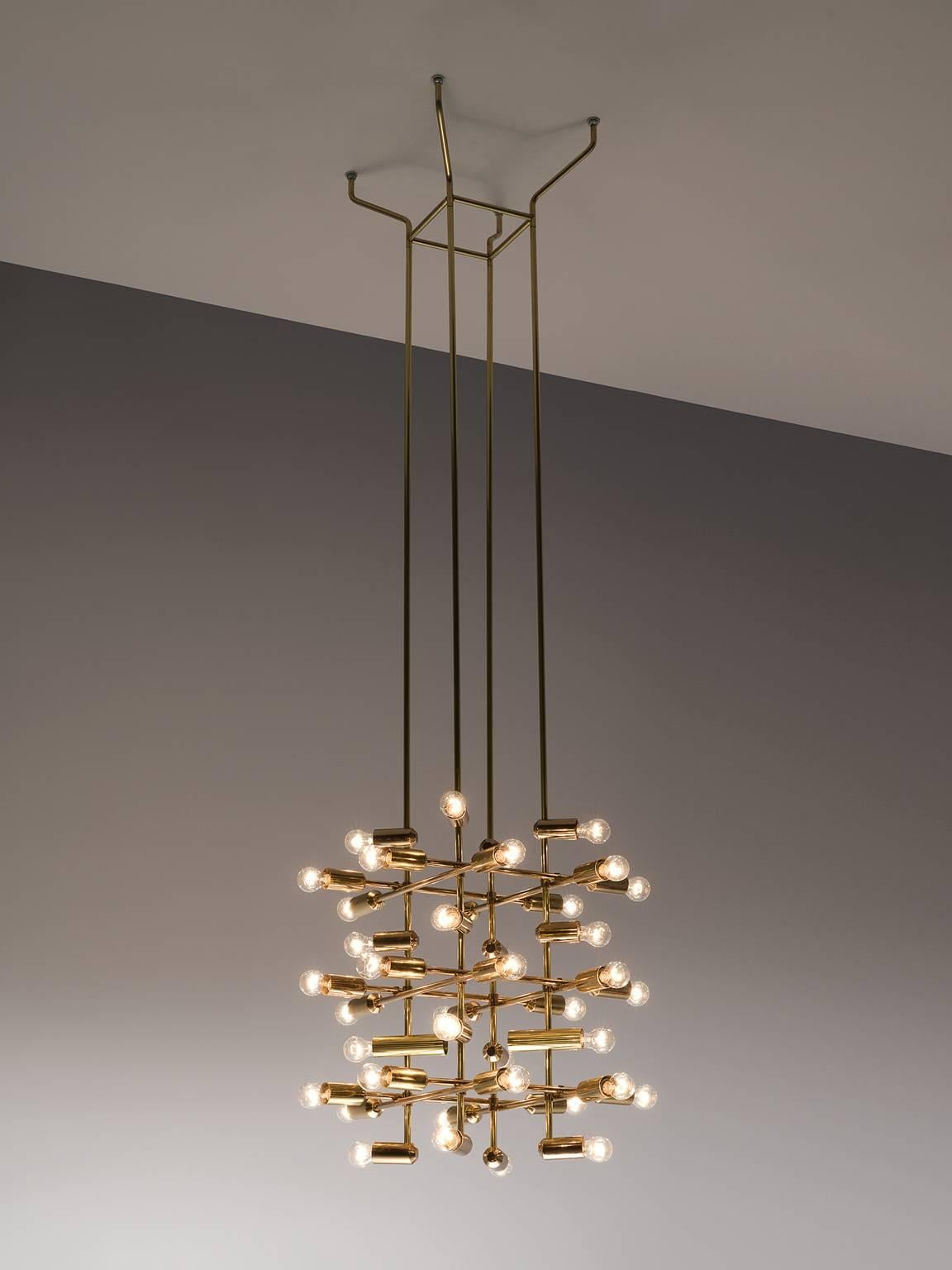 Chandelier brass, 1960s, Europe.

This set of 20 delicate chandeliers are Minimalist yet warm. Each light consists of forty light bulbs that are placed on the ends of brass horizontal beam. The beams form a cross-like pattern that is attached to the