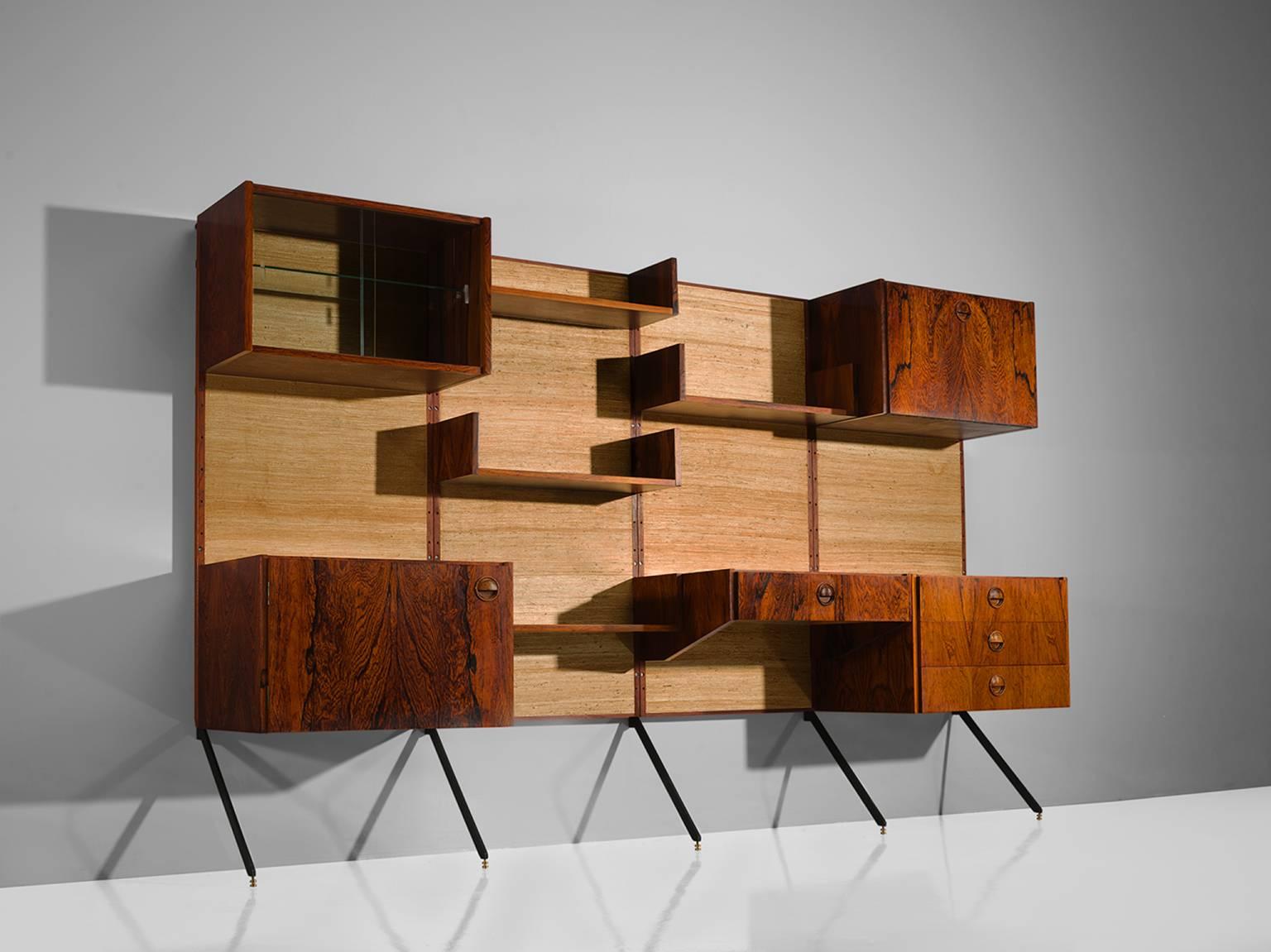 Fristho, rosewood, seagrass, the Netherlands, 1950s.

This very rare wall unit is executed in natural materials such as rosewood and seagrass. The combination of these rich, textural materials form a wonderful warm unity. The shelves can be freely