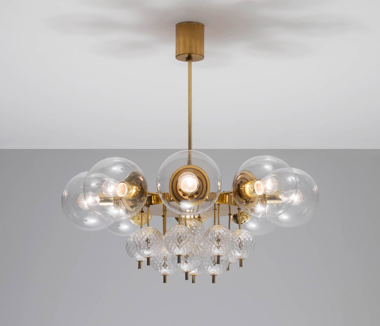 Large brass chandelier with beautiful glass bulbs, 1960s. 

This lights were found in the very south of the Czech Republic, so most likely from Austrian production seen their excellent quality with which they have been manufactured. Eight large